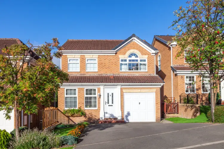 Large British detached house representing the EPC house price impact