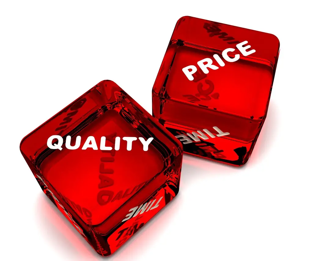 A pair of dice showing the difference between price and quality